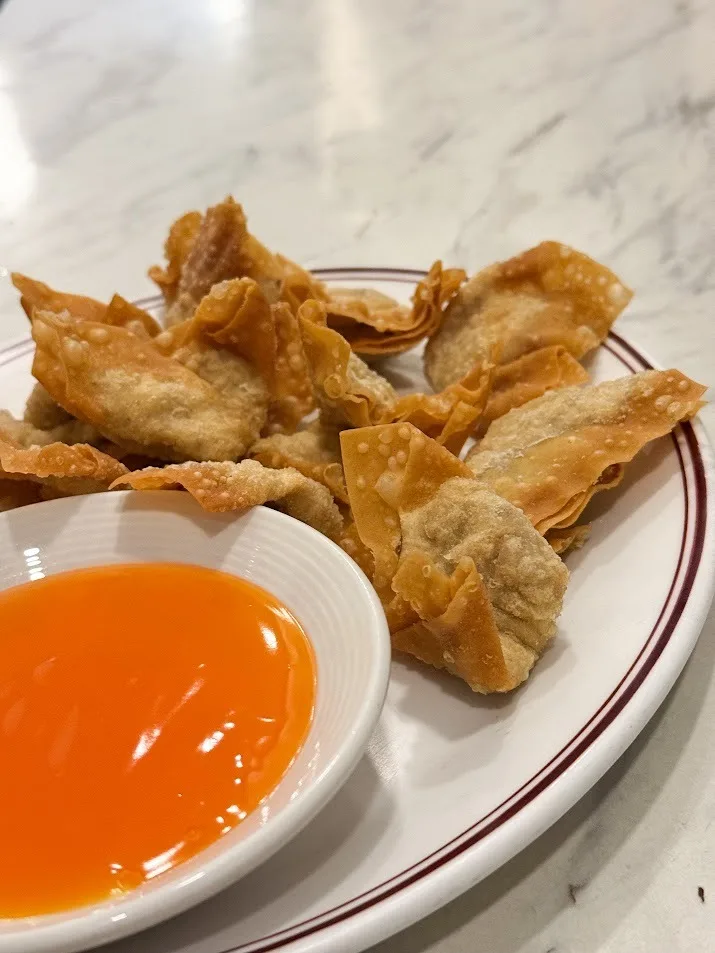 Crispy deep fried wontons with sweet and sour sauce