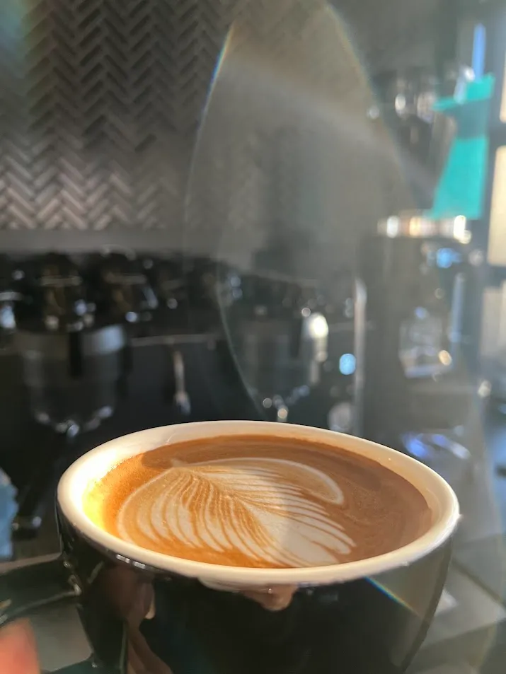 Latte art rosetta with house-roasted espresso